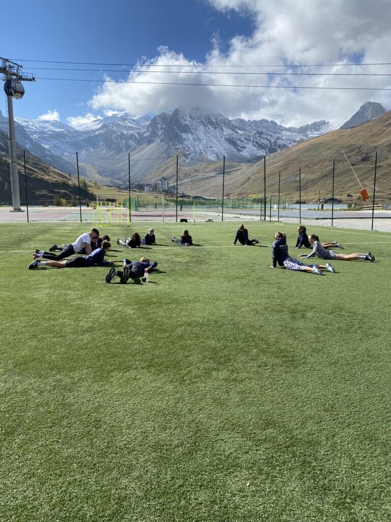 Group warming up on grass